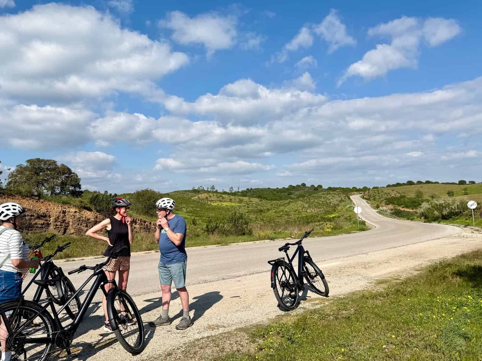 Cyclists resting during a ride on a beautiful countryside road in Portugal.